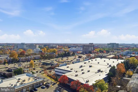 a view of a park with lots of swings and slides