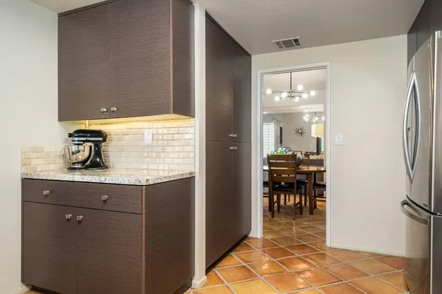 a view of living room filled with furniture and window