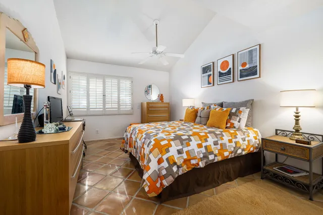 a bedroom with bed and window