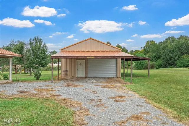 a front view of a house with a yard and porch