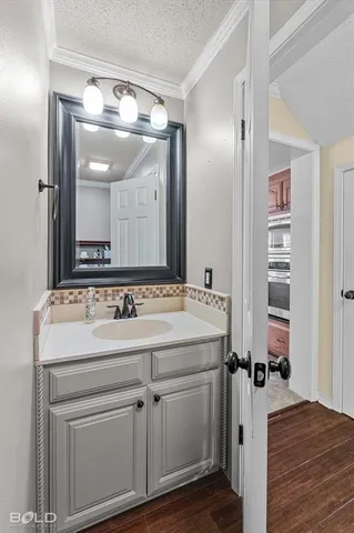 a view of a bathroom with a sink and mirror