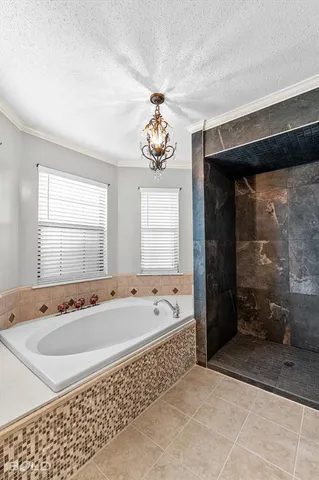 a spacious bathroom with a bathtub and a sink