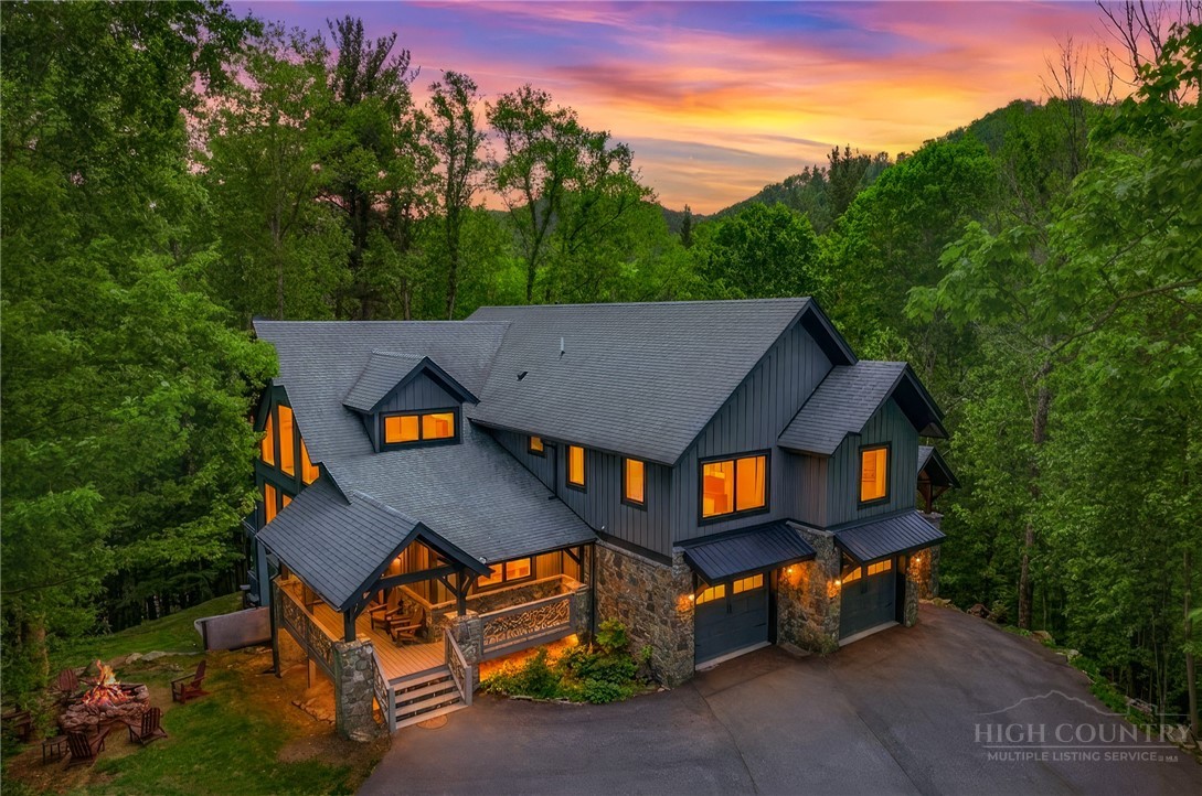 161 Hump View Trail Banner Elk, NC 28604 - Photo 1 of 50 an aerial view of a house with swimming pool and big yard