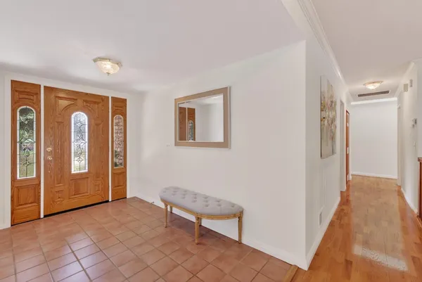 a view of a livingroom with furniture and an entryway