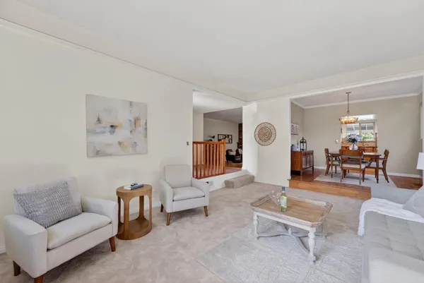 a living room with furniture and a table