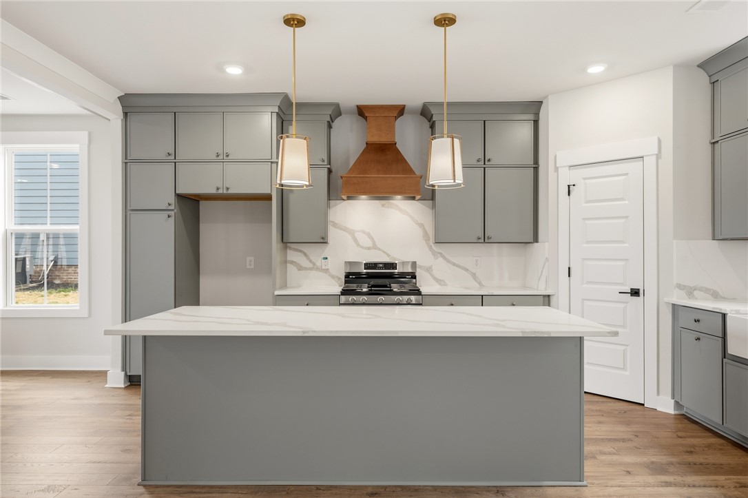319 Summerall Drive Anderson, SC 29621 - Photo 9 of 37 This contemporary kitchen features an inviting island, perfect for culinary endeavors and gatherings.