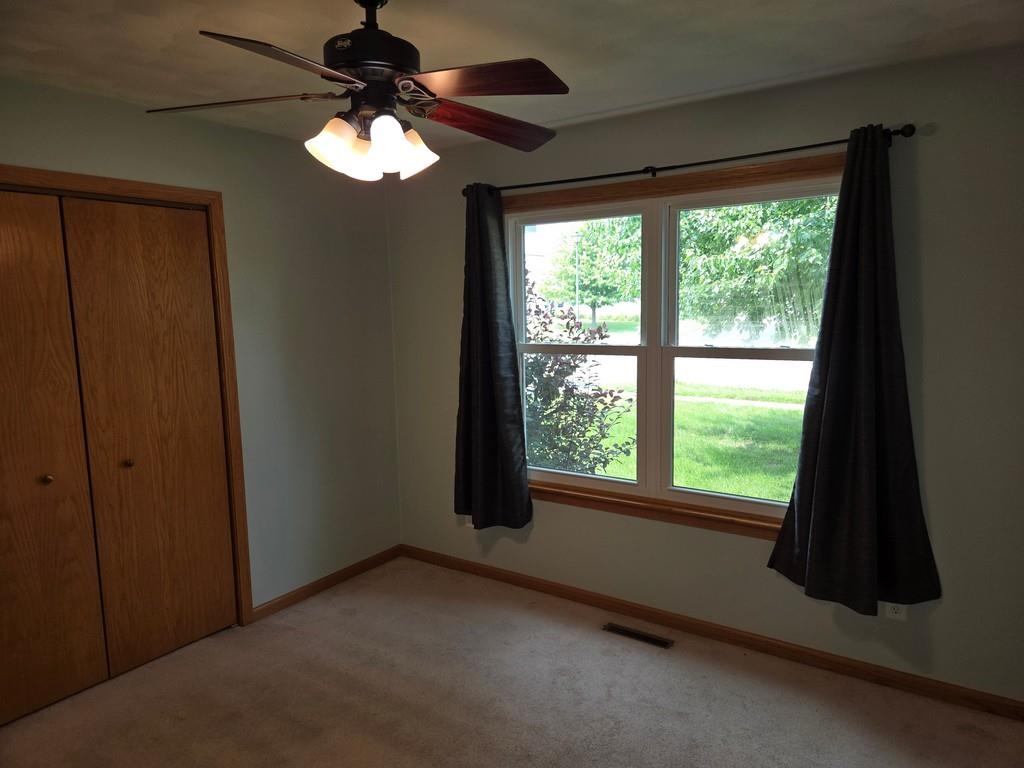 5563 Stockton Drive Rockford, IL 61109 - Photo 11 of 29 a view of a livingroom with a ceiling fan and window