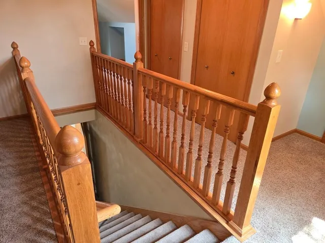 a view of stairs and wooden floor