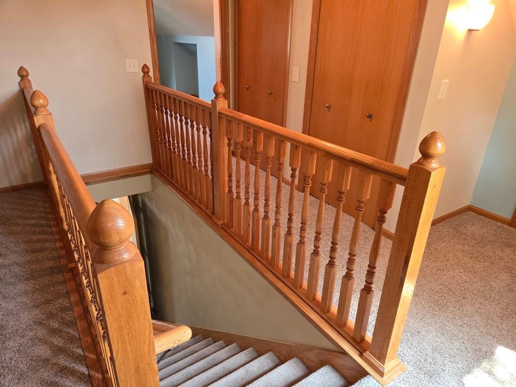 5563 Stockton Drive Rockford, IL 61109 - Photo 13 of 29 a view of stairs and wooden floor