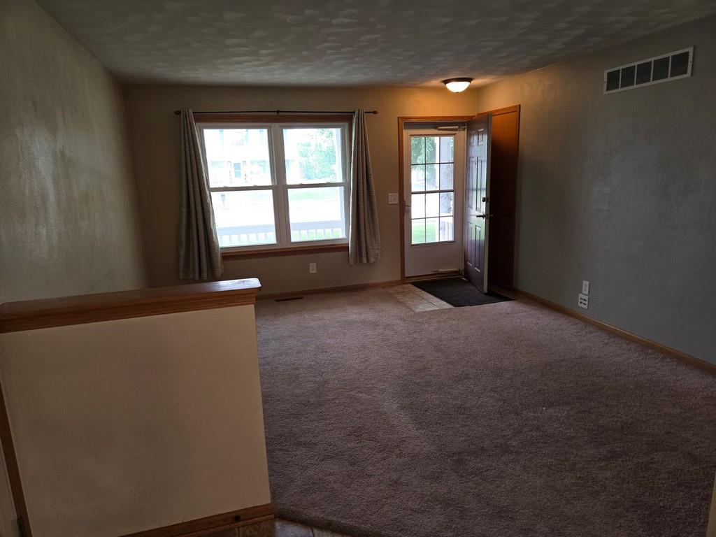 5563 Stockton Drive Rockford, IL 61109 - Photo 2 of 29 an empty room with windows