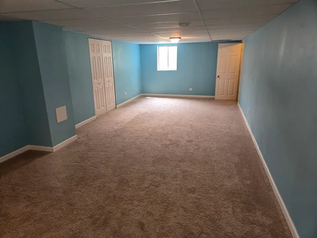 a view of a room with window and stairs