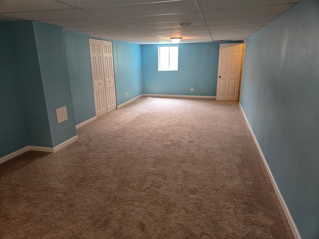 5563 Stockton Drive Rockford, IL 61109 - Photo 22 of 29 a view of a room with window and stairs