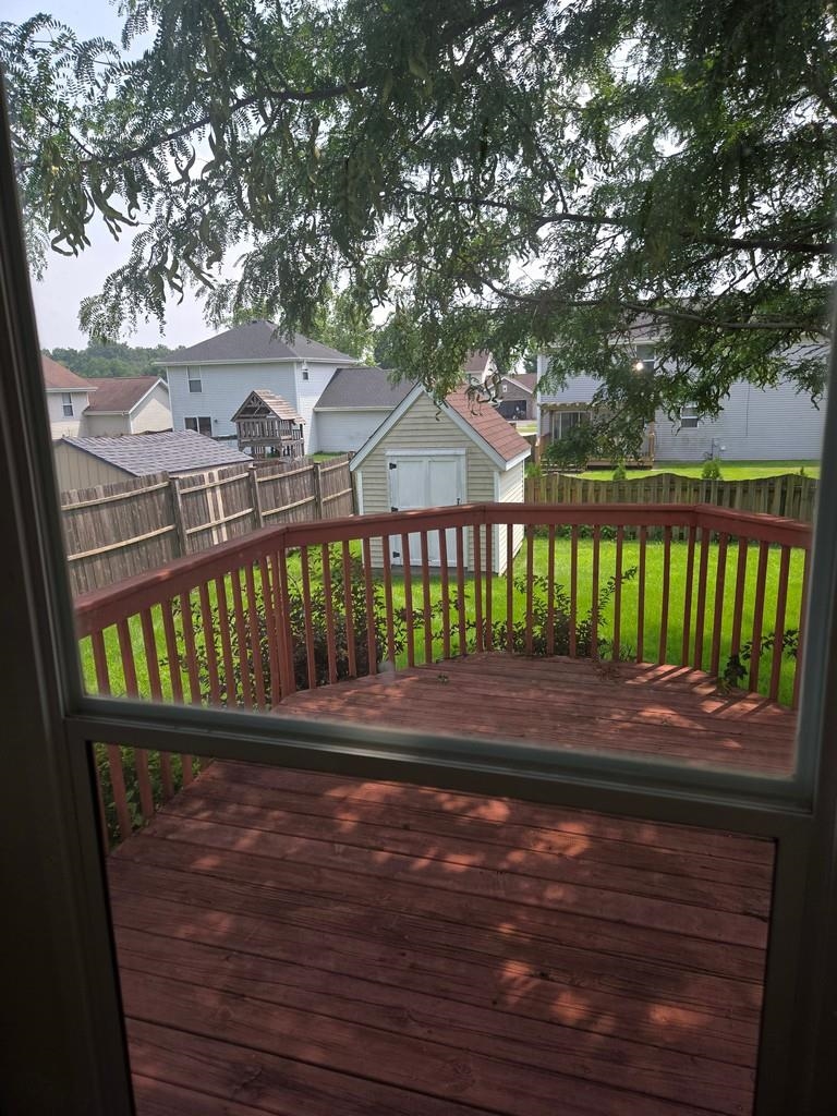 5563 Stockton Drive Rockford, IL 61109 - Photo 23 of 29 a view of a wooden deck