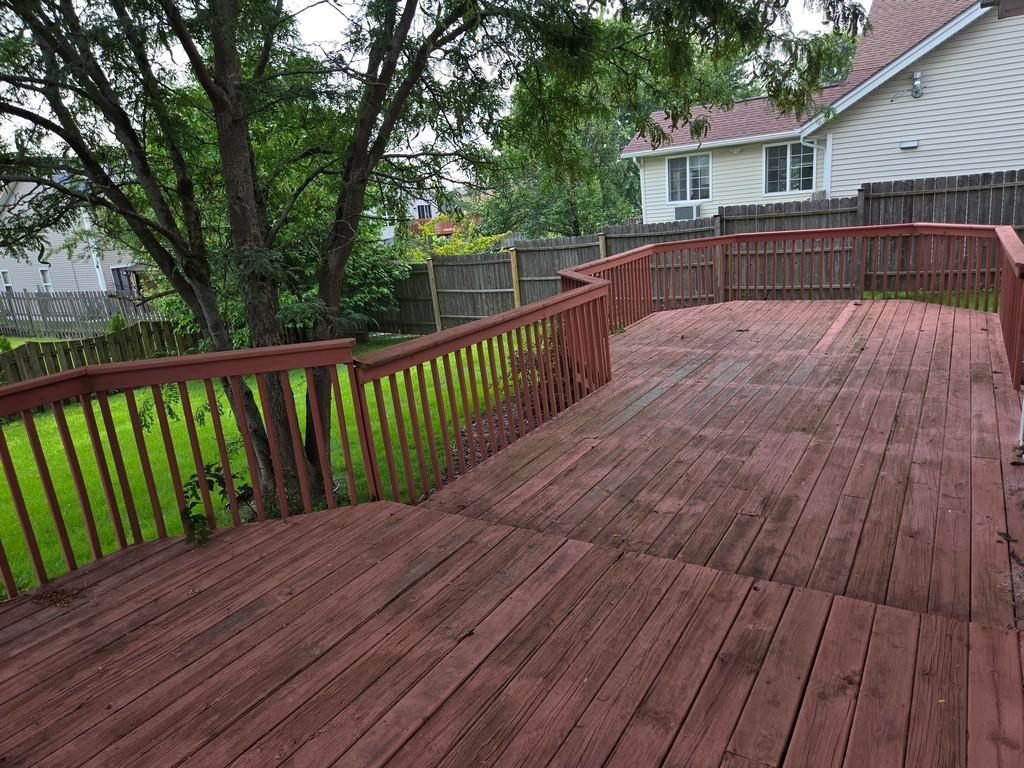 5563 Stockton Drive Rockford, IL 61109 - Photo 27 of 29 a view of balcony with wooden floor and fence