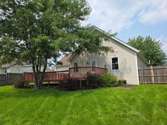 a view of backyard with garden and trees