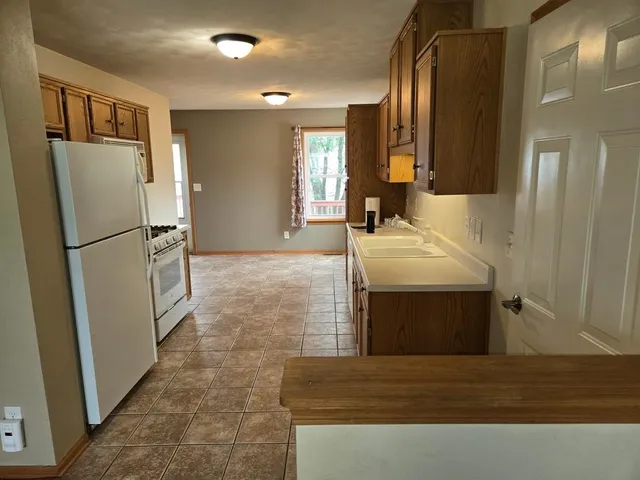 a bathroom with a sink a mirror and a shower