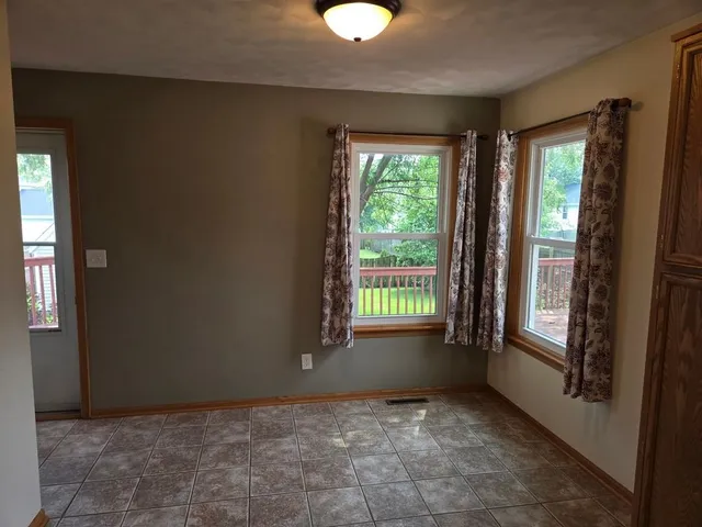 a view of an empty room and window