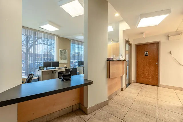 a view of a bathroom with a sink and a mirror