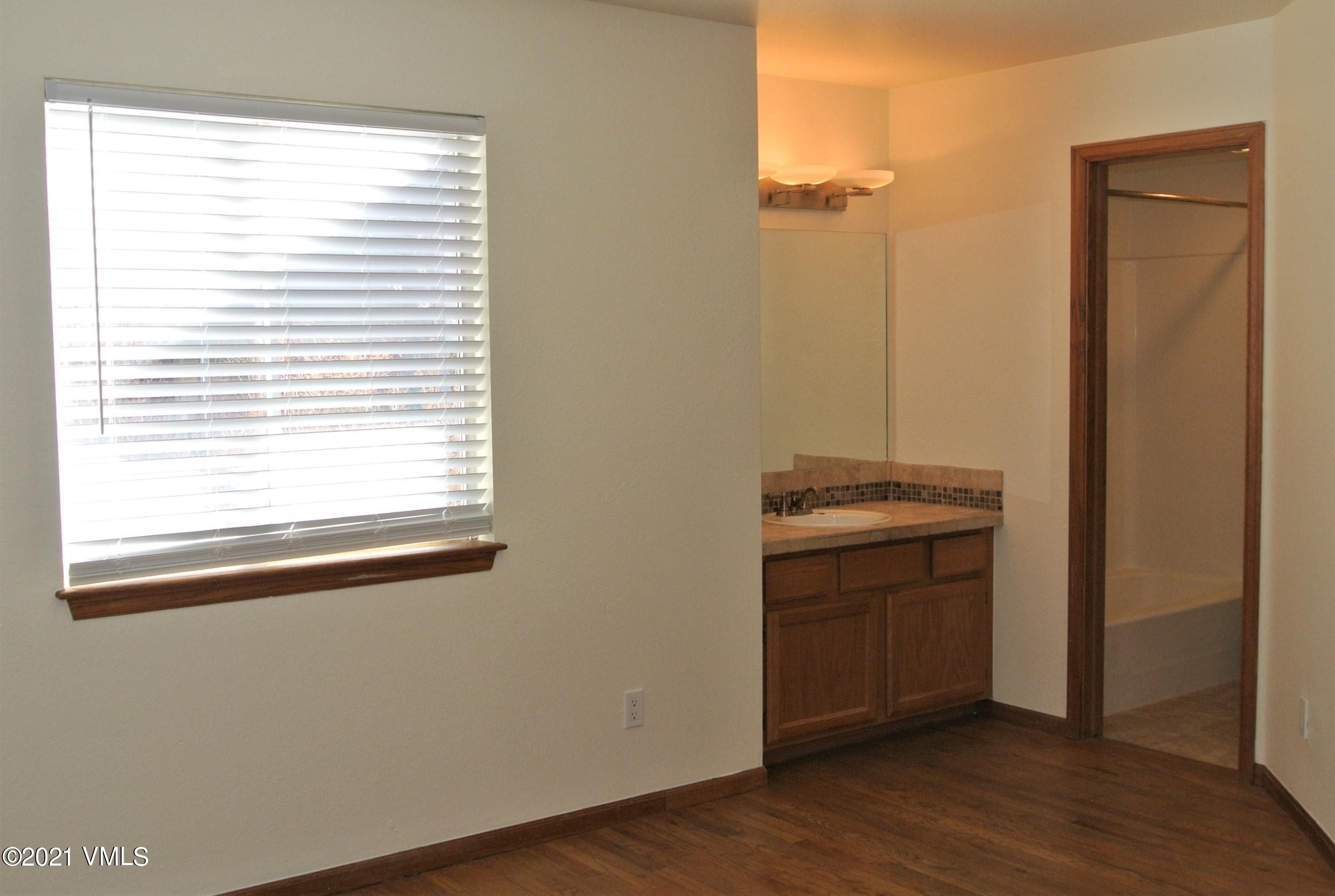 170 Eagle Road, Unit C Avon, CO 81620 - Photo 13 of 16 a view of a bathroom with a sink