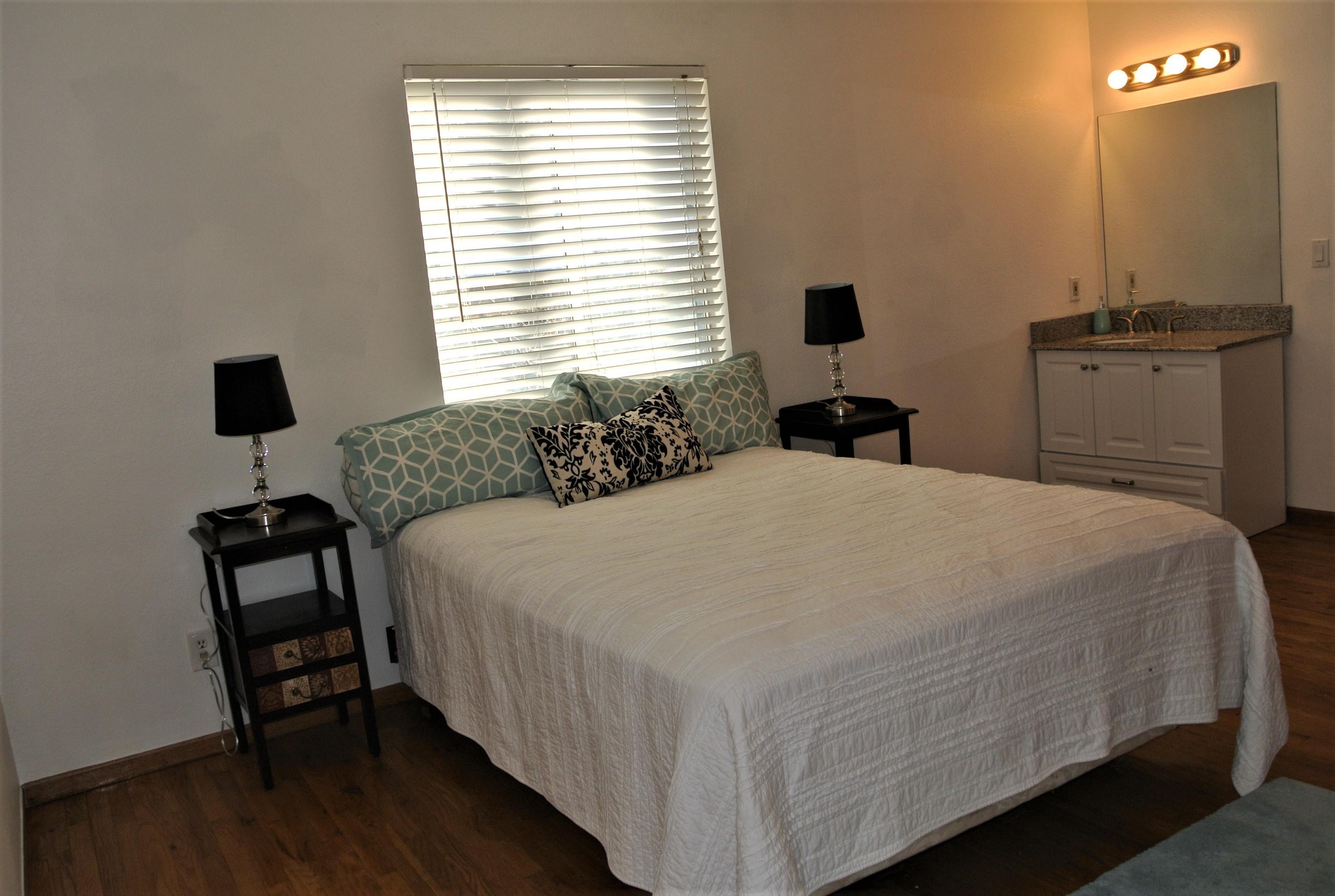 170 Eagle Road, Unit C Avon, CO 81620 - Photo 9 of 16 a bedroom with a bed and wooden floor