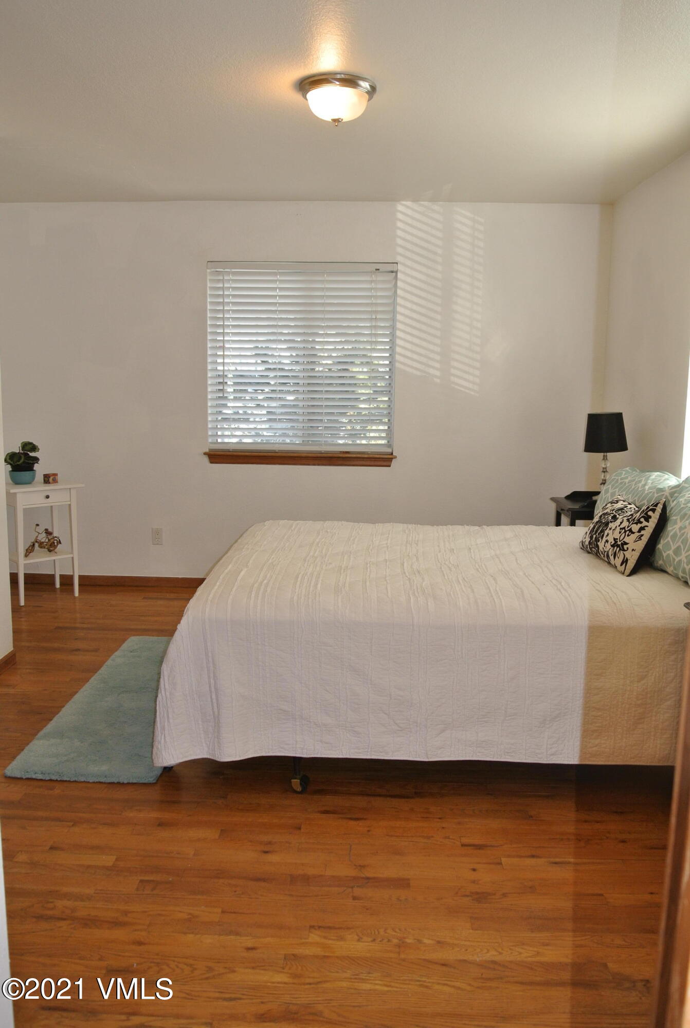 170 Eagle Road, Unit C Avon, CO 81620 - Photo 10 of 16 a bedroom with a bed and a view of kitchen