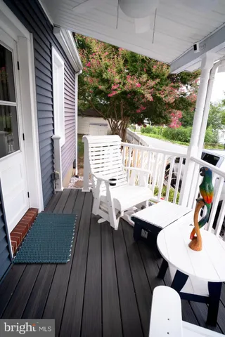 a front view of a house with yard and patio