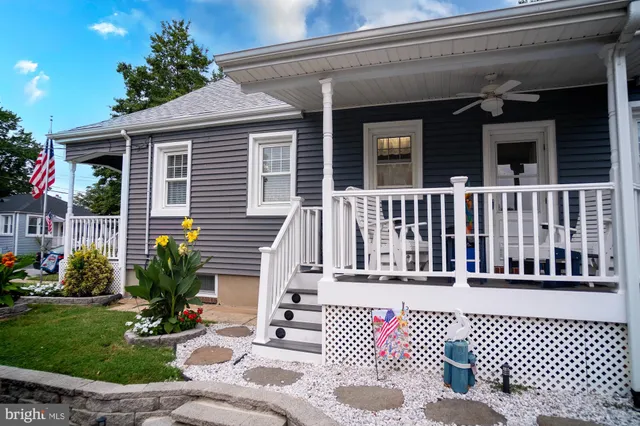 a view of a house with a chairs in patio
