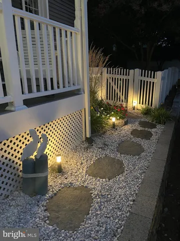a front view of a house with a yard table and chairs