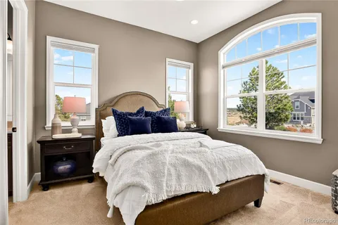 a living room with furniture a dining table and kitchen view