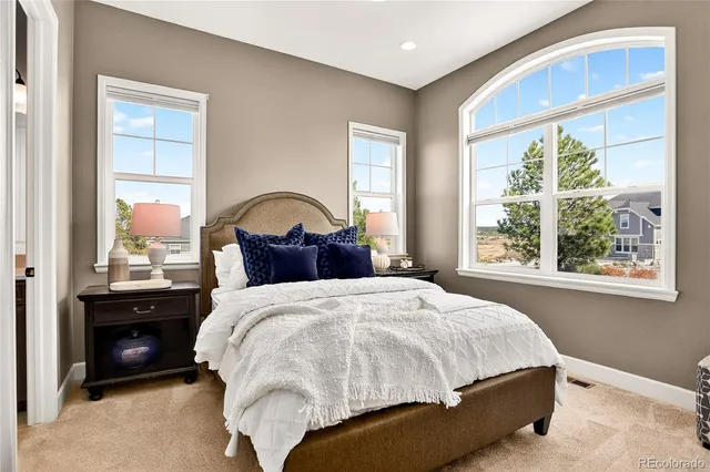 a living room with furniture a dining table and kitchen view