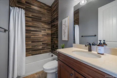 a bedroom with a bed and a table