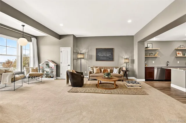 a view of a balcony with furniture and wooden floor