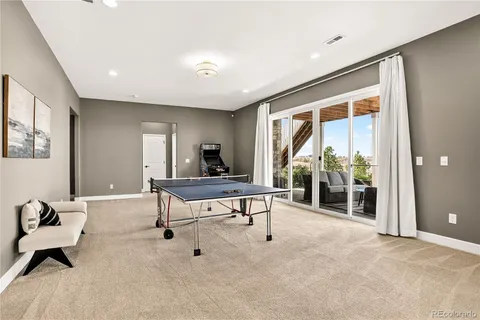 a front view of a house with a garden and plants