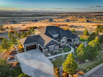 a view of water heater room with wooden floor
