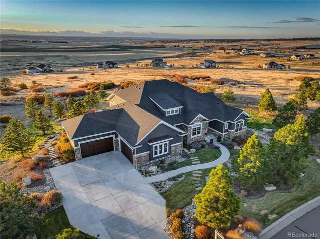 a view of water heater room with wooden floor