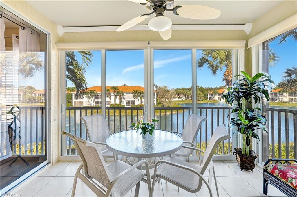 10910 Santa Margherita Road, Unit 204 Estero, FL 34135 - Photo 20 of 42 Sunroom featuring a water view, tile patterned floors, and plenty of natural light