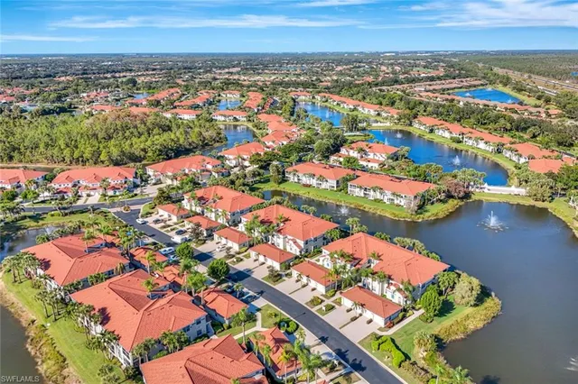 a view of a town with big trees
