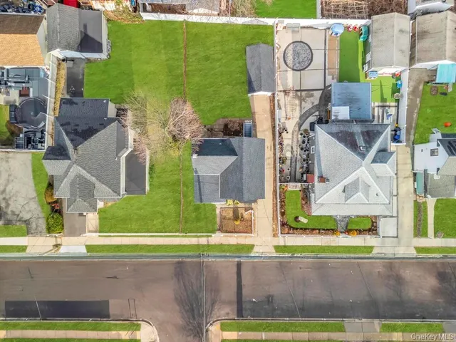 an aerial view of a house with a garden and yard