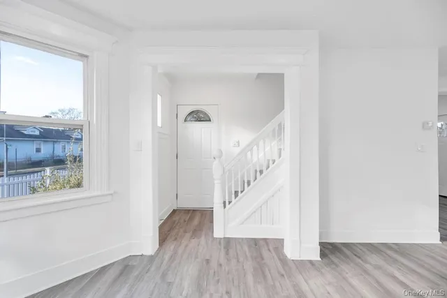 a view of entryway with wooden floor