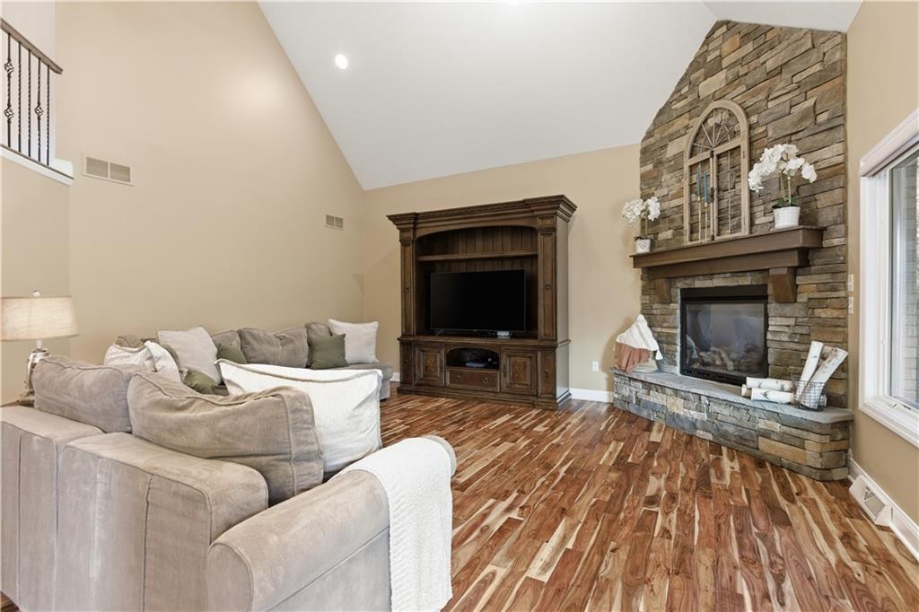 280 Sienna Trail Venetia, PA 15367 - Photo 14 of 37 a living room with furniture a flat screen tv and a fireplace