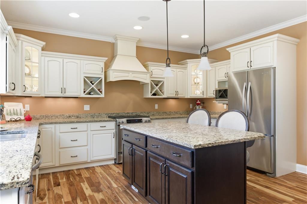 280 Sienna Trail Venetia, PA 15367 - Photo 15 of 37 a kitchen with stainless steel appliances granite countertop a sink a stove and a refrigerator
