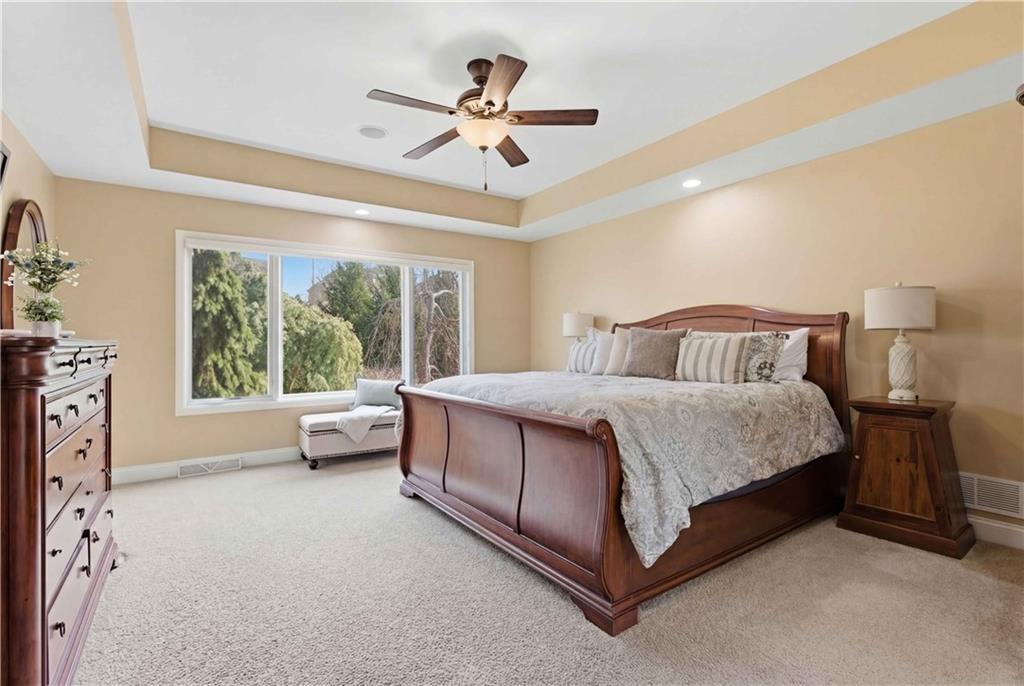 280 Sienna Trail Venetia, PA 15367 - Photo 19 of 37 a bedroom with a large bed and a chandelier