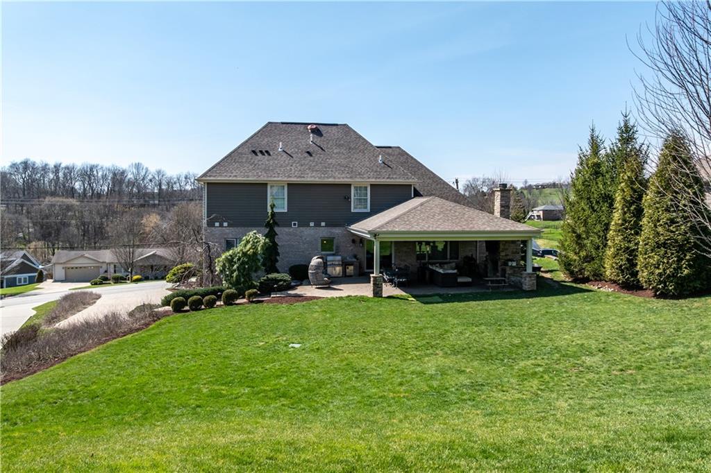 280 Sienna Trail Venetia, PA 15367 - Photo 8 of 37 a view of a patio with table and chairs under an umbrella
