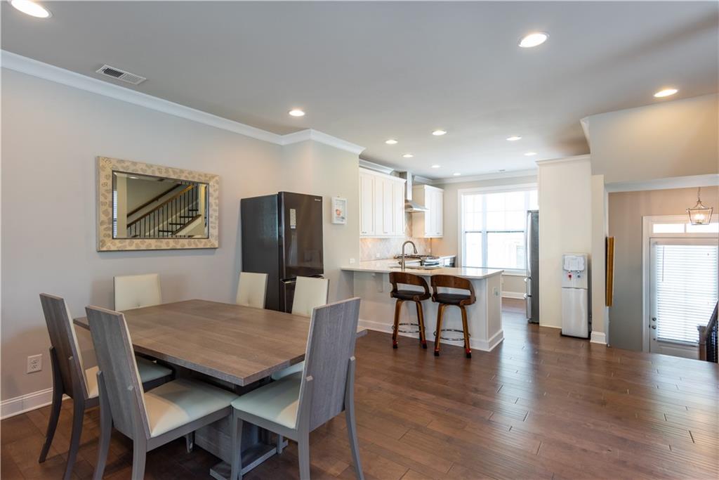 5247 Cresslyn Ridge Alpharetta, GA 30005 - Photo 12 of 38 a view of a dining room with furniture and wooden floor
