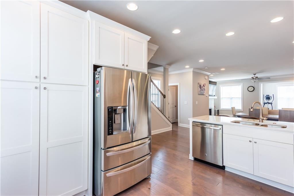 5247 Cresslyn Ridge Alpharetta, GA 30005 - Photo 16 of 38 a kitchen with a sink stainless steel appliances and cabinets
