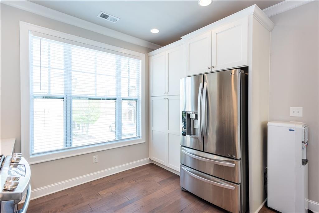 5247 Cresslyn Ridge Alpharetta, GA 30005 - Photo 17 of 38 a metallic refrigerator freezer sitting in a kitchen