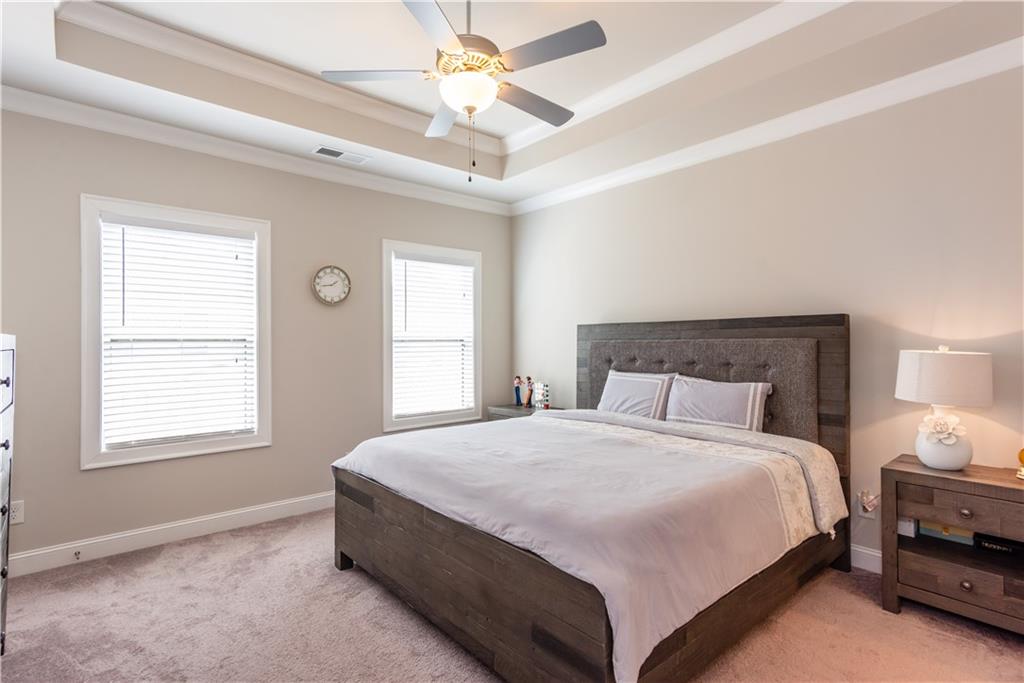 5247 Cresslyn Ridge Alpharetta, GA 30005 - Photo 24 of 38 a bedroom with a bed and a window