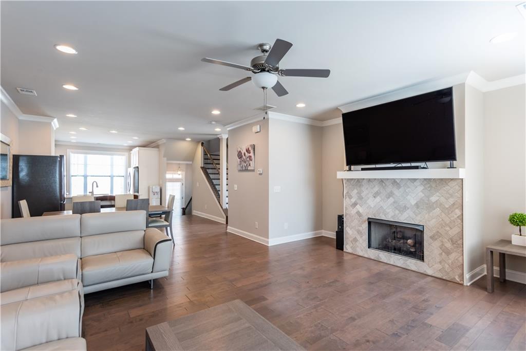5247 Cresslyn Ridge Alpharetta, GA 30005 - Photo 7 of 38 a living room with furniture and a fireplace