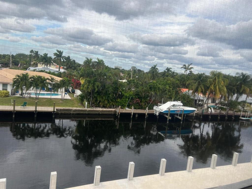 a view of a lake with a car parked