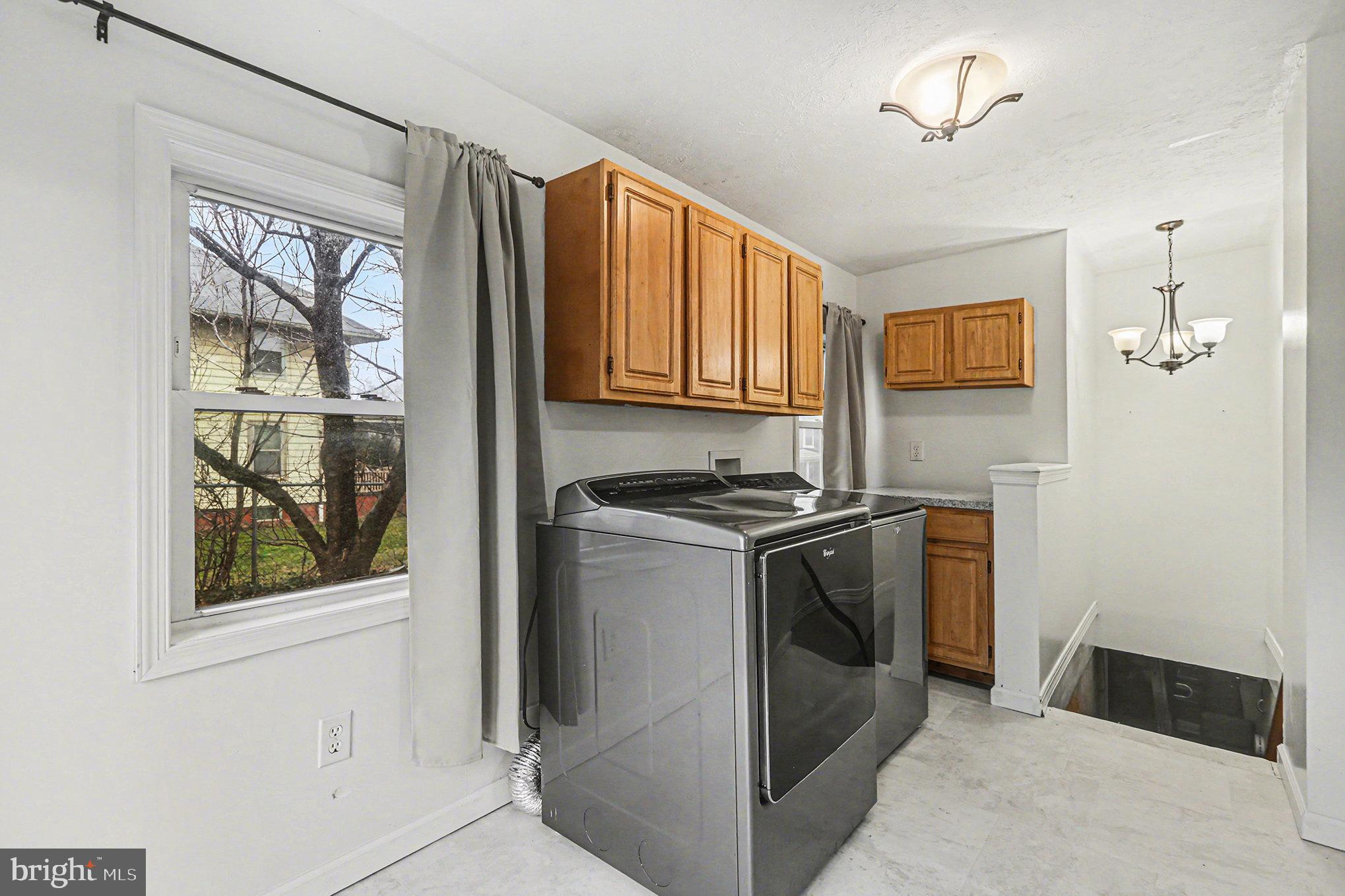 458 Highland Street Harrisburg, PA 17113 - Photo 14 of 31 a kitchen with stainless steel appliances granite countertop a stove and a refrigerator